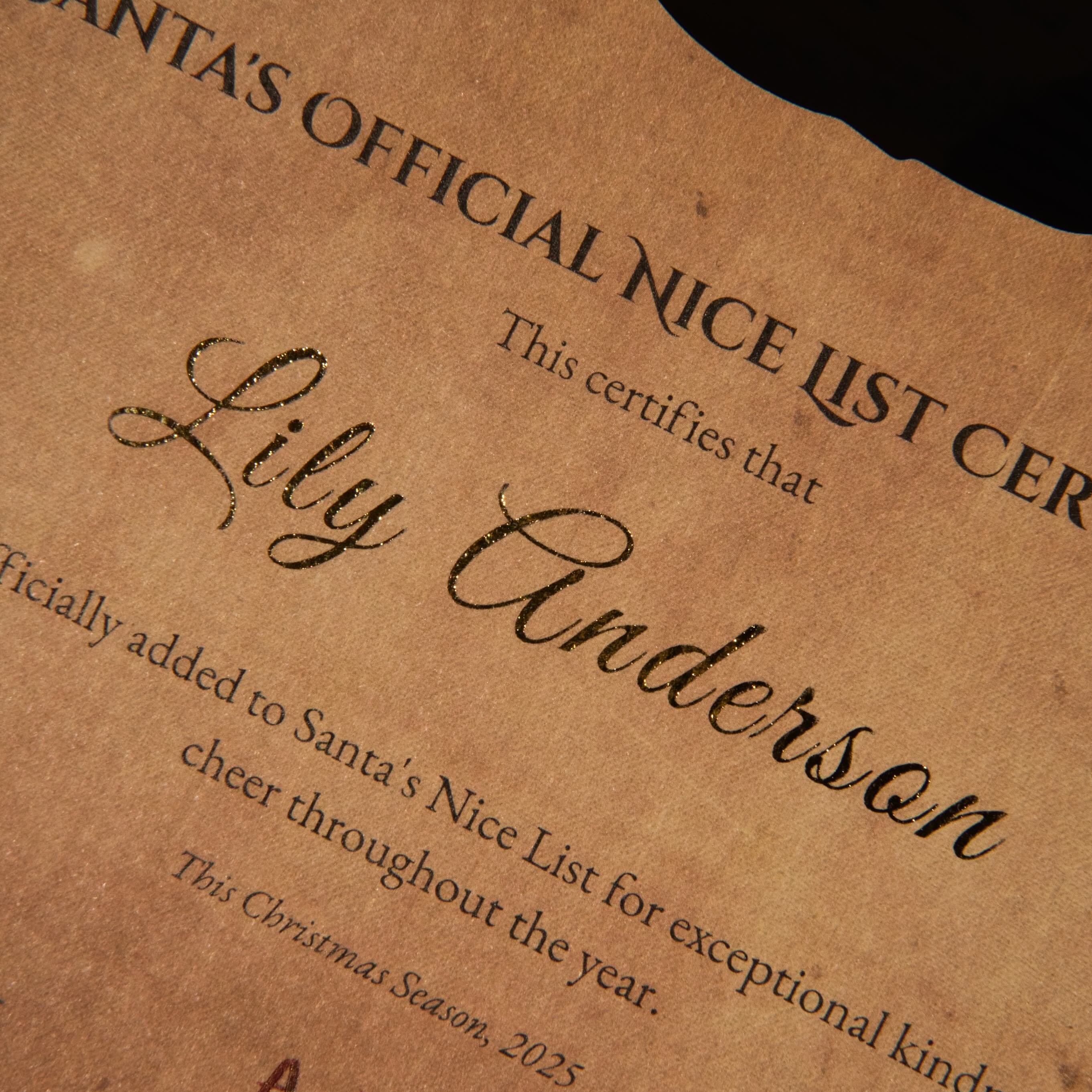 Brown paper certificate with 'Santa's Official Nice List' text and personalized name.